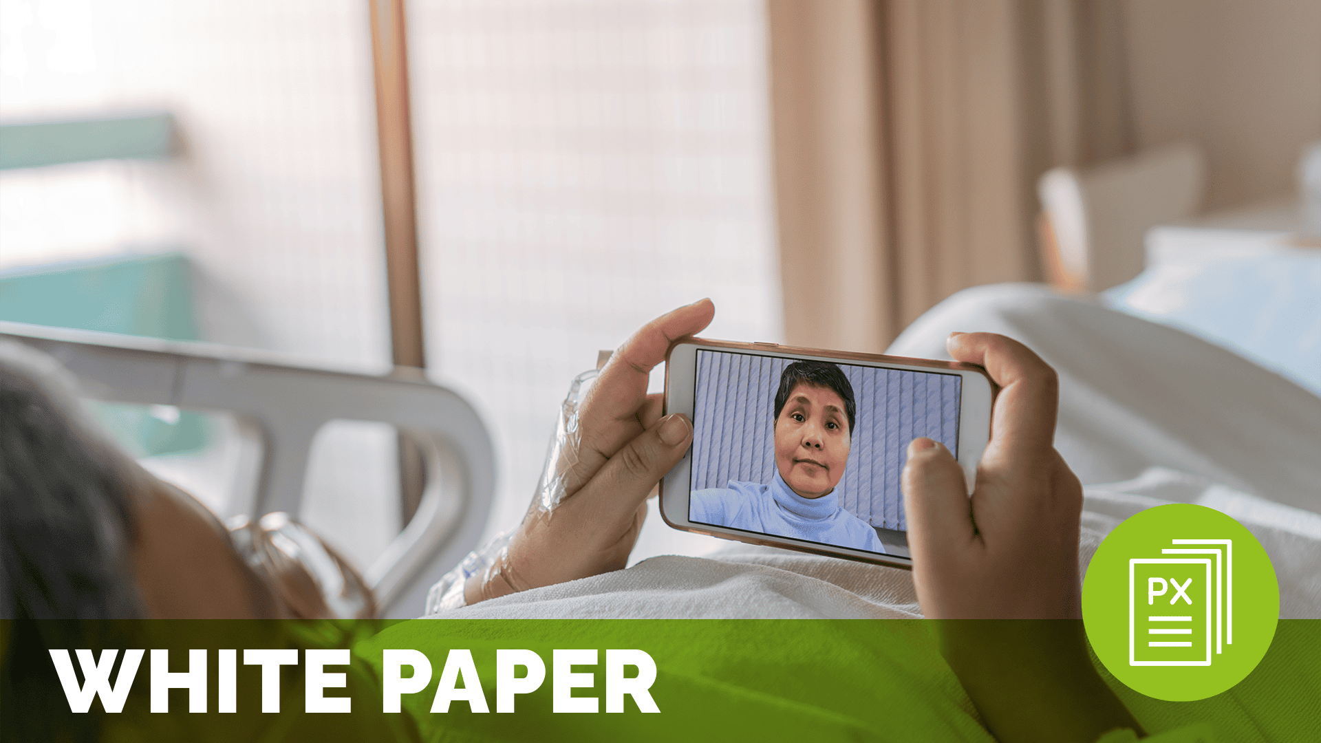 a person in a hospital bed, communicating with someone on a phone through a video call