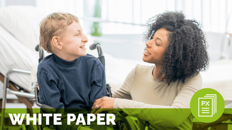a woman and a boy in a wheelchair smiling at one another